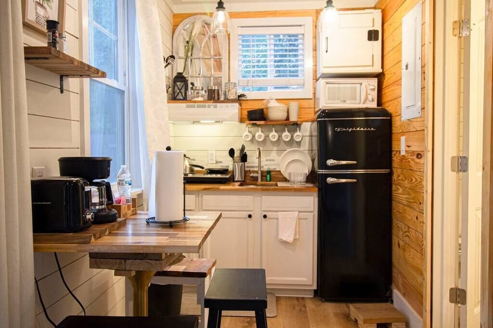 Kitchen fully stocked with essentials. Coffee machine, toaster, microwave, pans, etc.