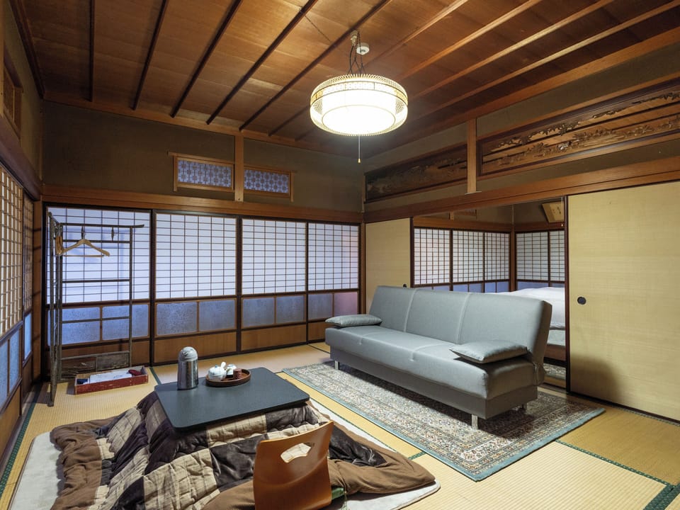 Deluxe Quadruple Room | Desk, WiFi (free), bed sheets