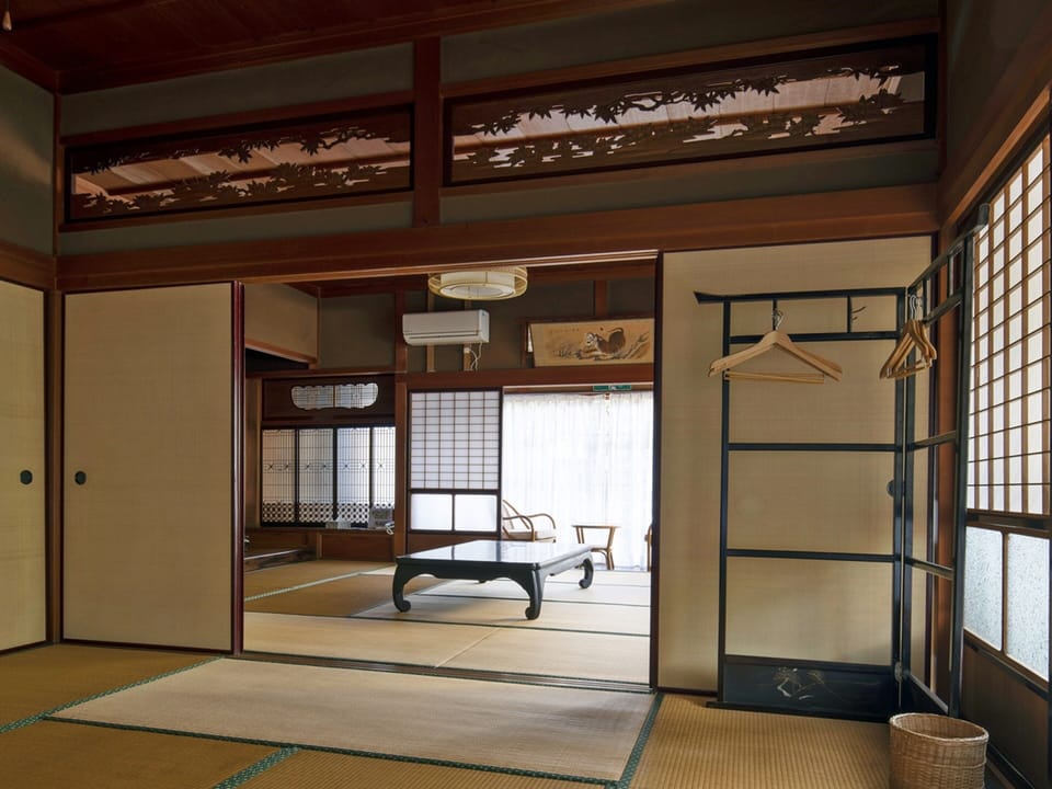 Deluxe Quadruple Room | Desk, WiFi (free), bed sheets