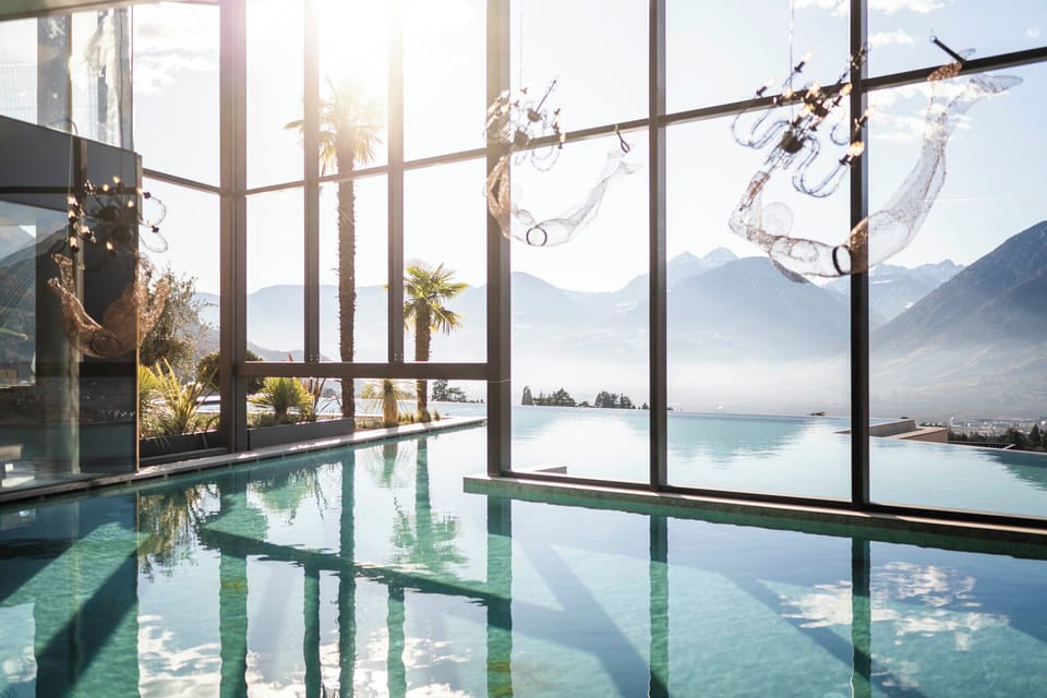 2 indoor pools, 2 outdoor pools, open 7:00 AM to 7:00 PM, pool umbrellas