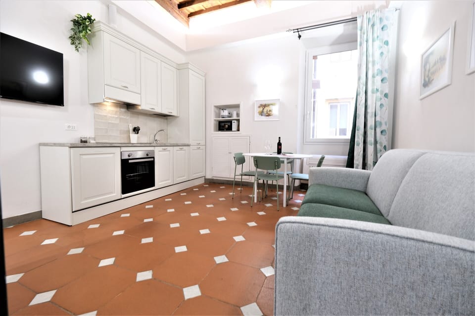 Apartment | Living area | 70-inch flat-screen TV with digital channels