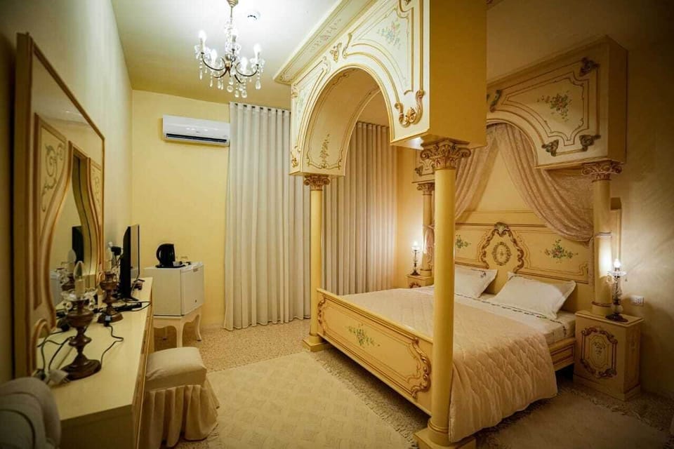 Deluxe Room | Living area | 32-inch LED TV with satellite channels