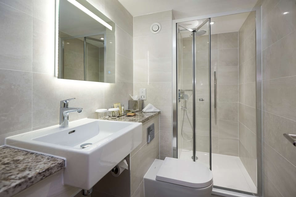 Suite, 1 Queen Bed, Balcony | In-room safe, desk, laptop workspace, blackout drapes