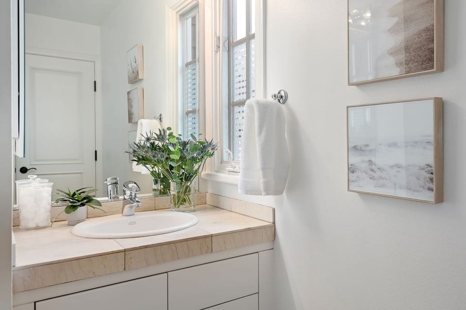 Water closet off of the primary bathroom, with another entrance off hallway