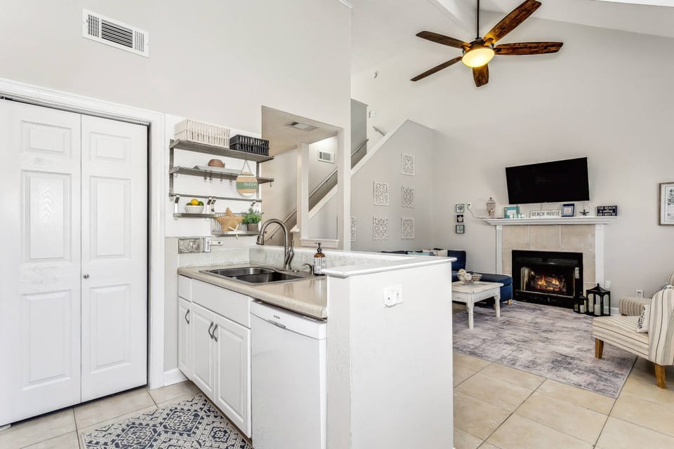Kitchen sink overlooks living room