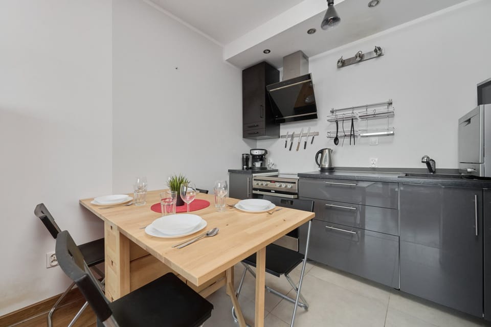 Bright kitchen with cooking utensils. 