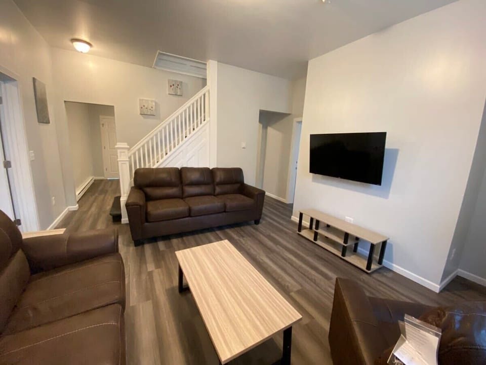 Comfortable couches, a flat-screen TV, and a coffee table make this living room perfect for relaxing.