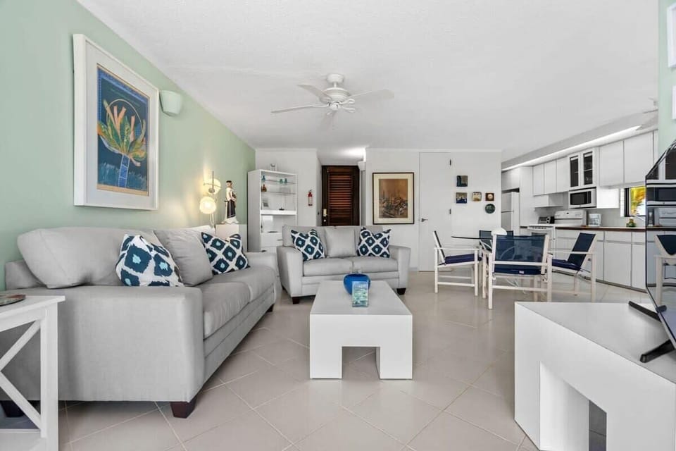The living room with two sofas and flat screen TV