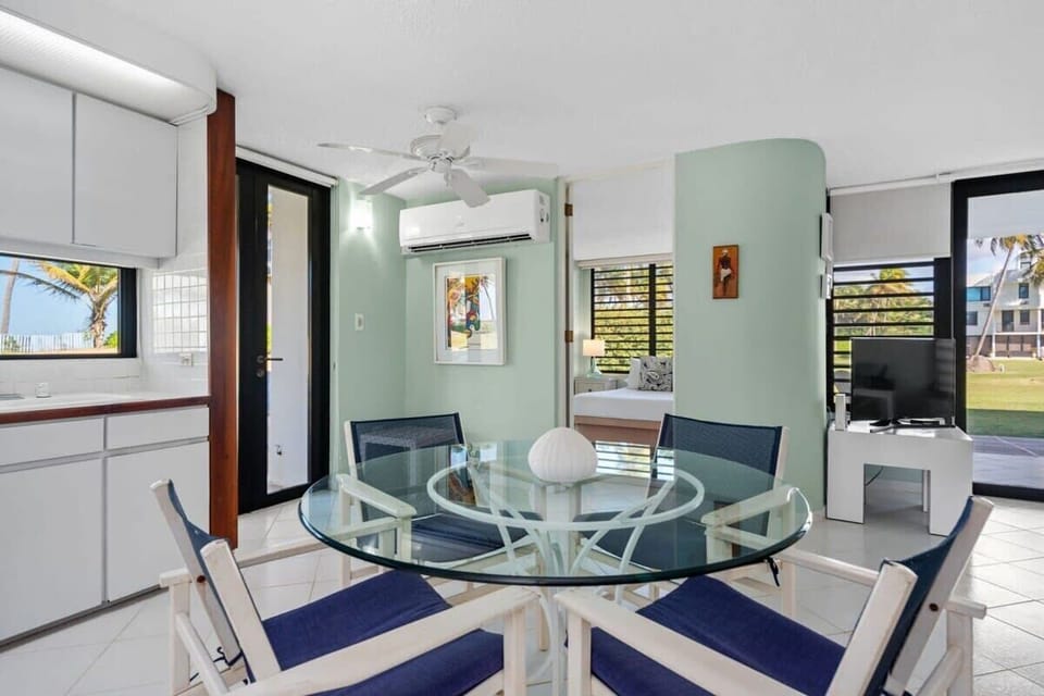 The dining table right next to the kitchen.