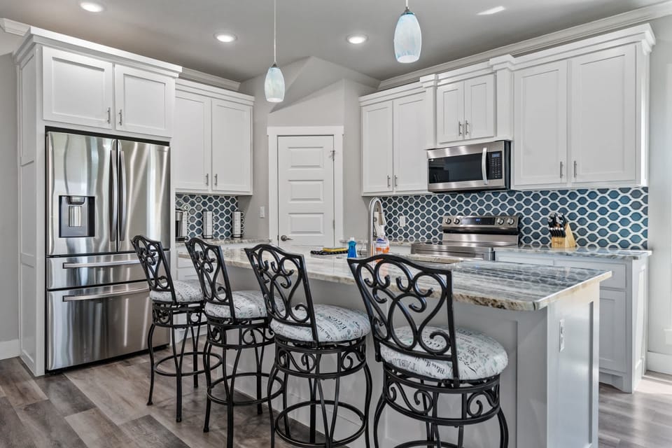 Pull up a stool at the granite island