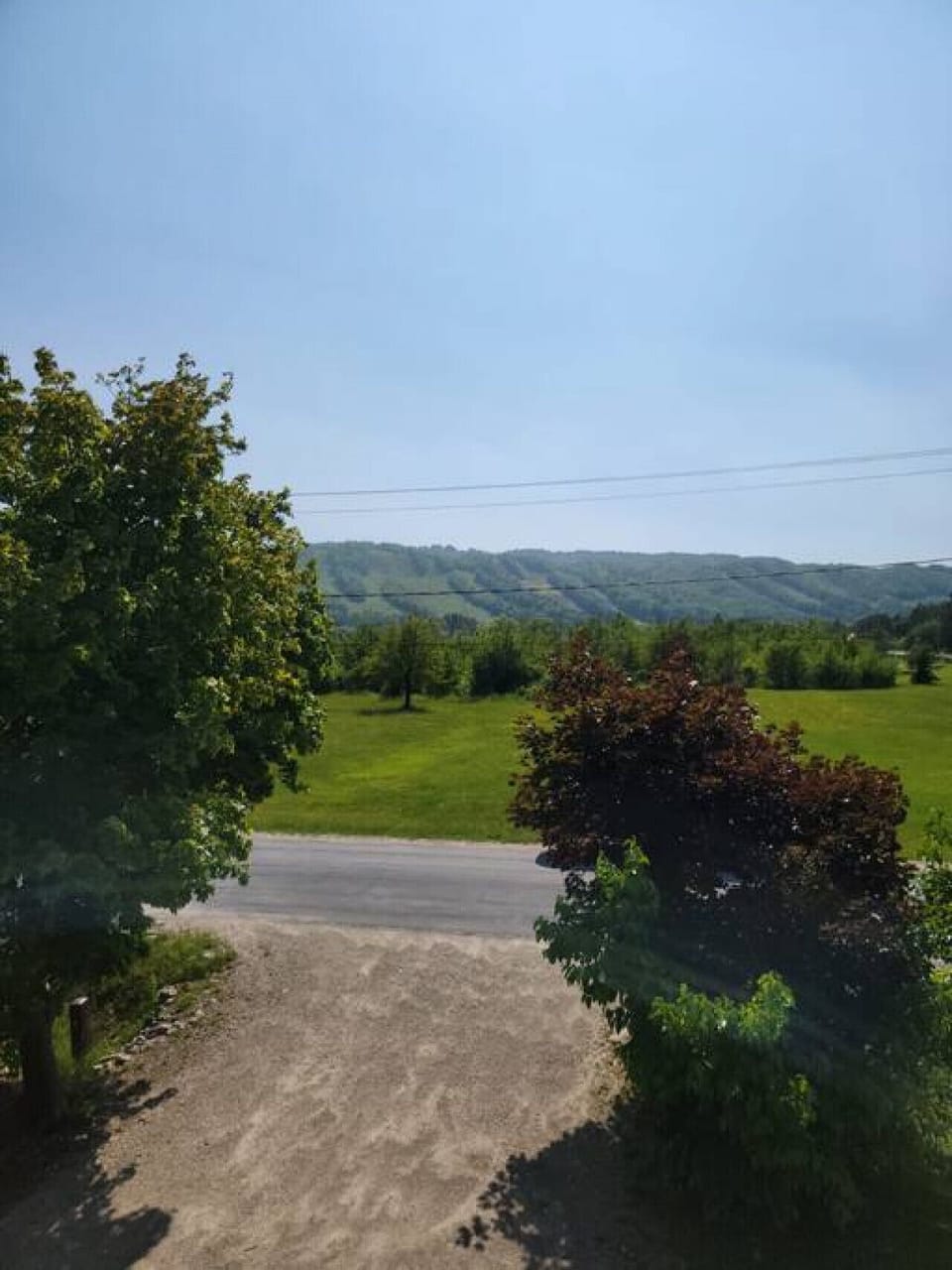 View from the front of the Chalet facing the road and the beautiful mountains from the driveway.  The driveway can park 5 vehicles.