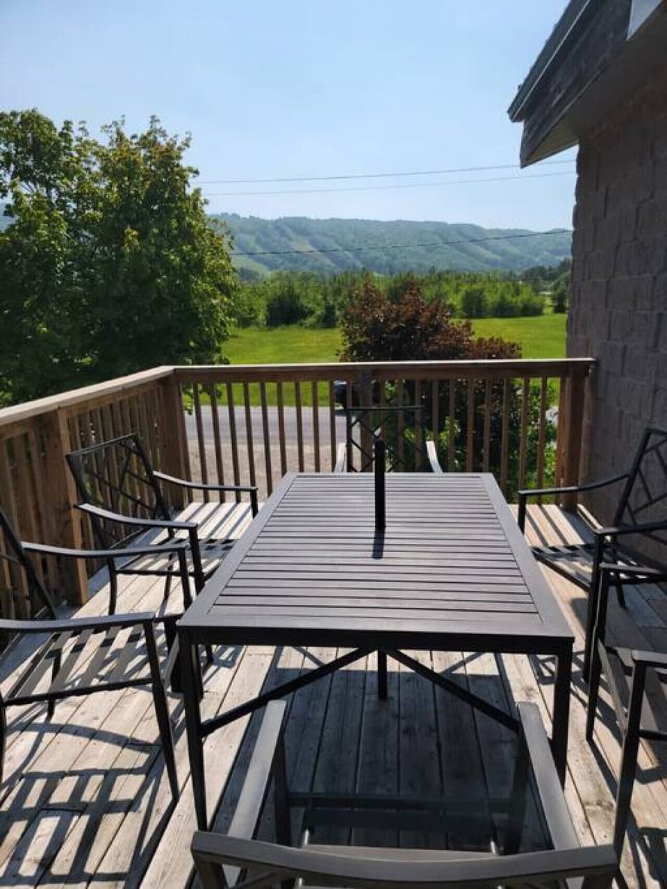 Another photo of the patio table on deck located off the top level.  A beautiful view of the mountain/slopes.