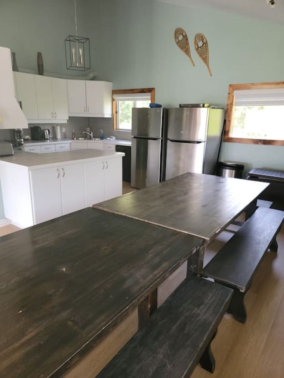 Kitchen and dining area.  Lots of space for a large group to sit at the picnic style tables.  There are also 2 fridges for your use.