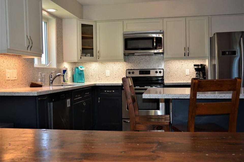 View of the kitchen from the solid-wood dining table