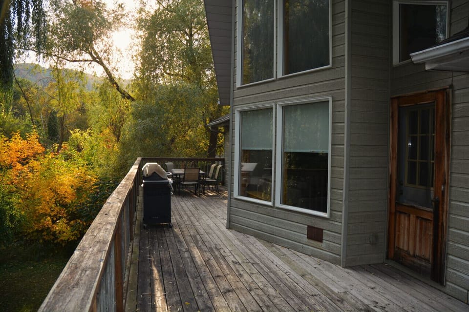 Standing on second floor W/O deck in early autumn looking towards the table and BBQ