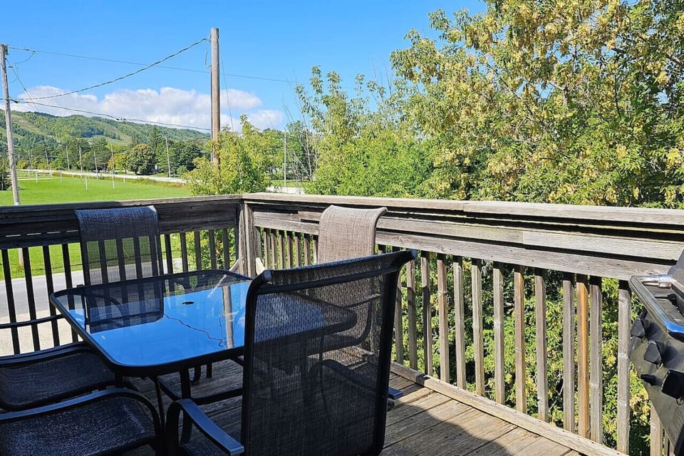 Standing on the balcony over the outdoor dining table and seating