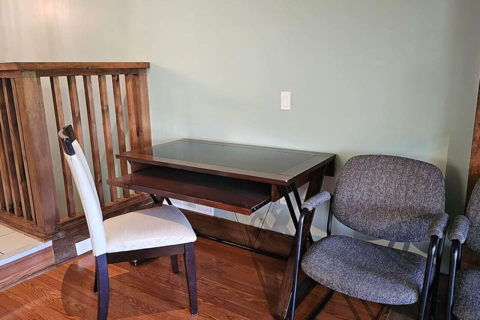 Small desk behind the staircase on upper level suitable for some quiet work if needed