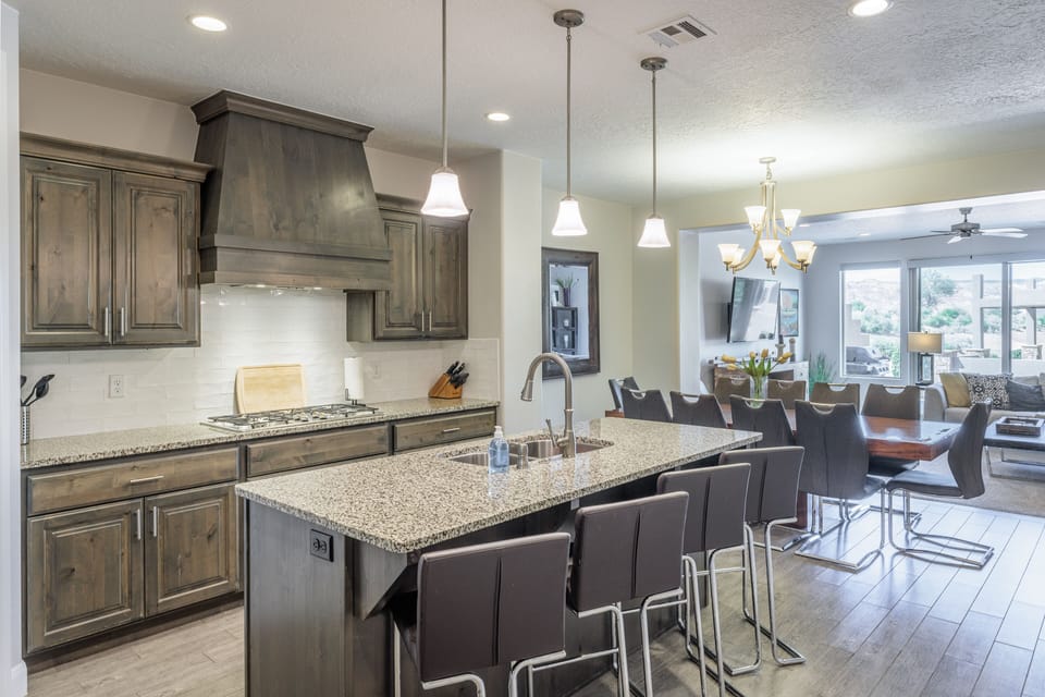 Kitchen Side View - The Kitchen Island comfortably seats 4 adults and creates a great space for serving and preparing meals.