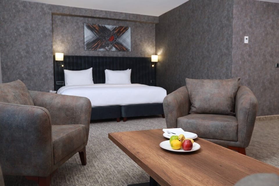 Premium bedding, free minibar items, desk, laptop workspace