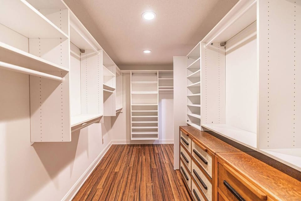 Huge primary walk-in closet in our primary ensuite.