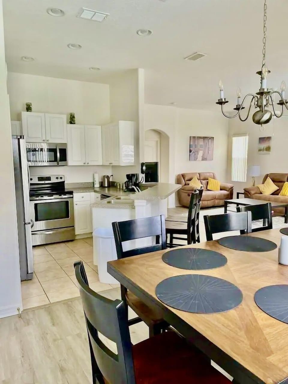The living, dining and kitchen spaces all link and compliment each other