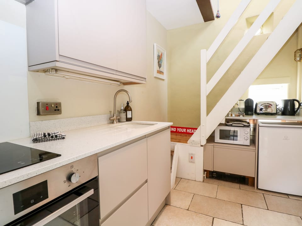 Fridge, electric kettle, toaster, cookware/dishes/utensils