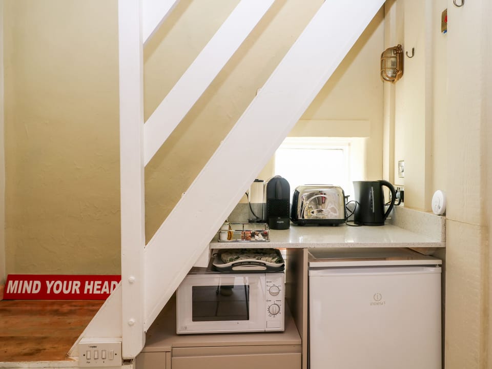 Fridge, electric kettle, toaster, cookware/dishes/utensils
