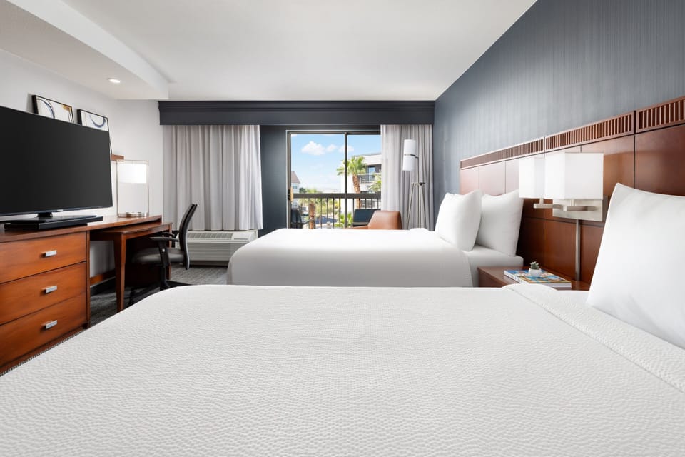 Hypo-allergenic bedding available, in-room safe, desk