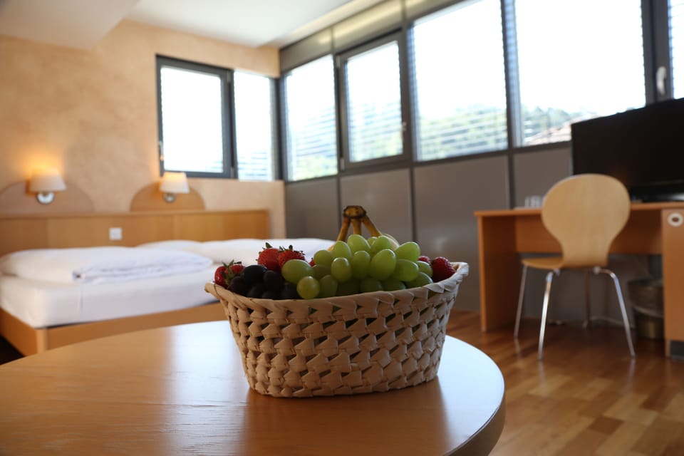 Deluxe Quadruple Room | In-room safe, desk, blackout drapes, free WiFi