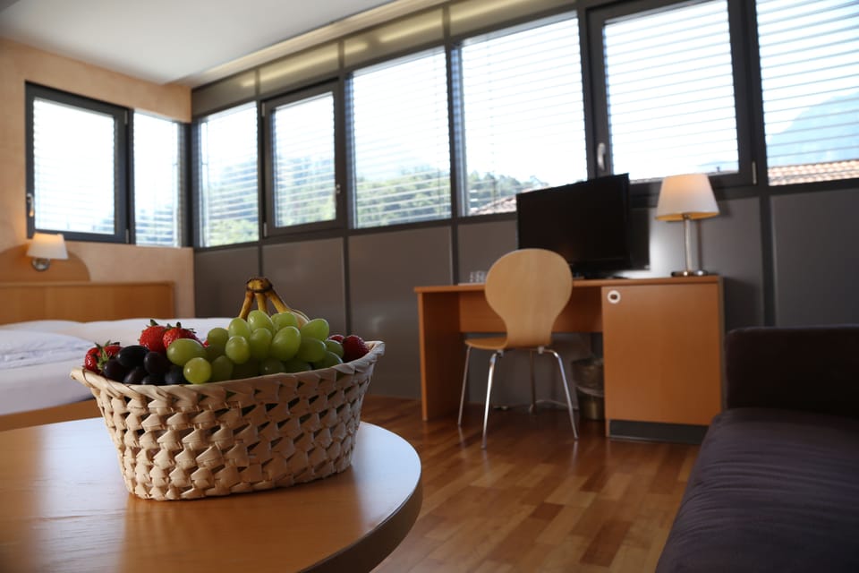 Deluxe Quadruple Room | In-room safe, desk, blackout drapes, free WiFi