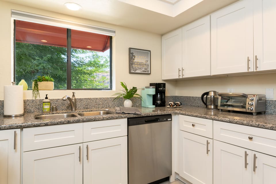Kitchen sink with views in the fully stocked kitchen.