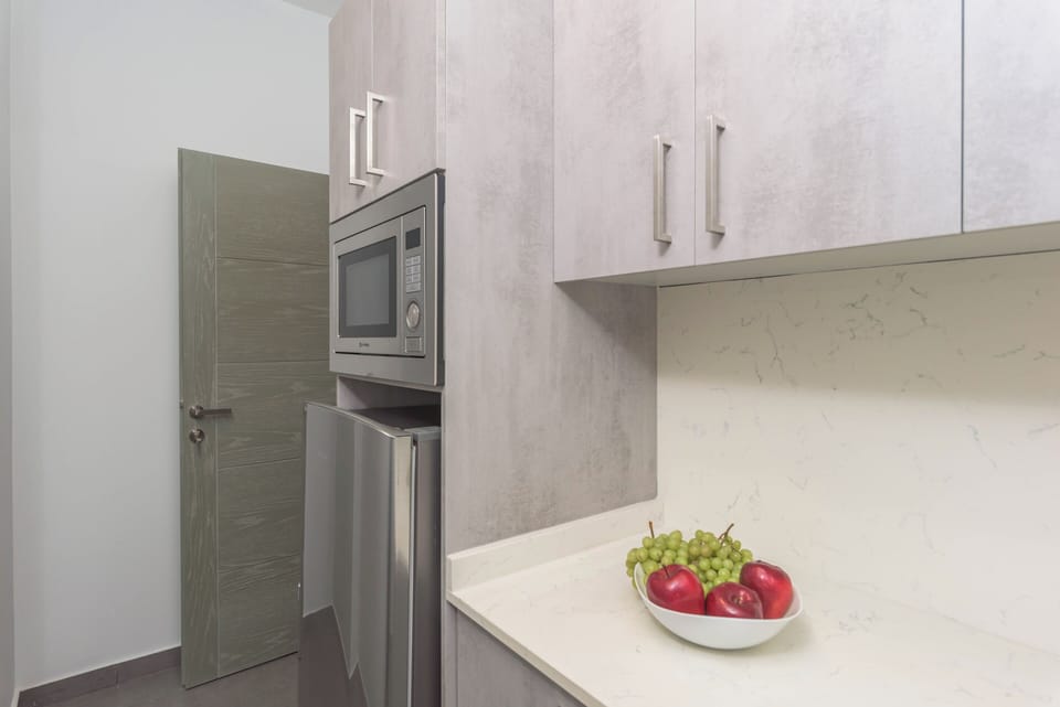 Mini-fridge, microwave, electric kettle, cookware/dishes/utensils