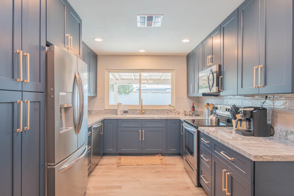 Beautifully revamped kitchen that overlooks the backyard and pool