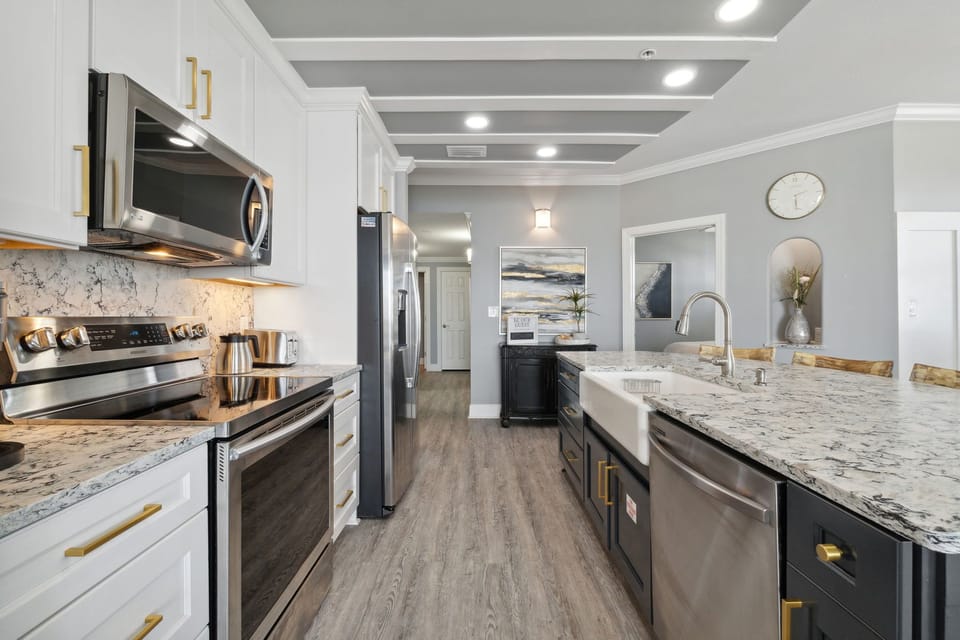 Fully equipped kitchen with granite countertops and stainless appliances for effortless vacation dining