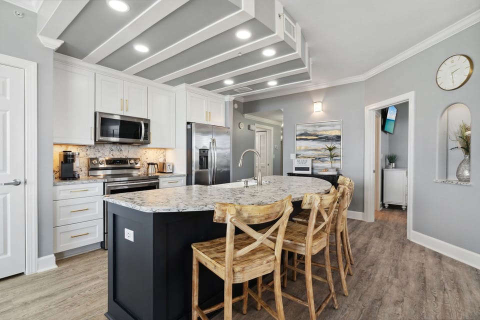 Fully equipped kitchen with granite countertops and stainless appliances for effortless vacation dining
