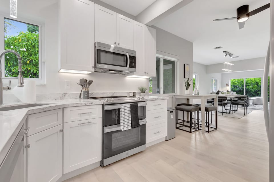 Your bright white kitchen makes it easy to cook, snack, and gather between beach days, pool time, and nights out in Delray Beach.