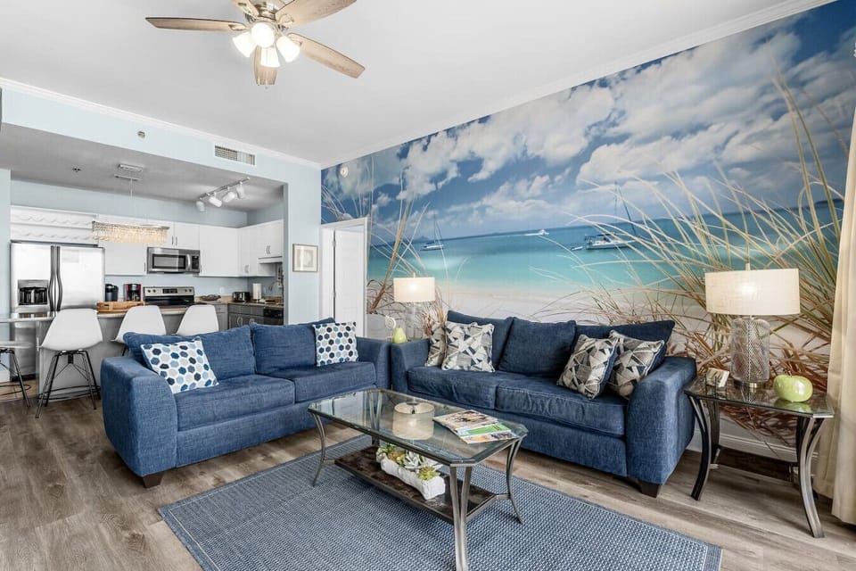 Bright, Open Living Area with Panoramic Ocean Views, Private Balcony Access, Custom Mural and Flat Screen TV