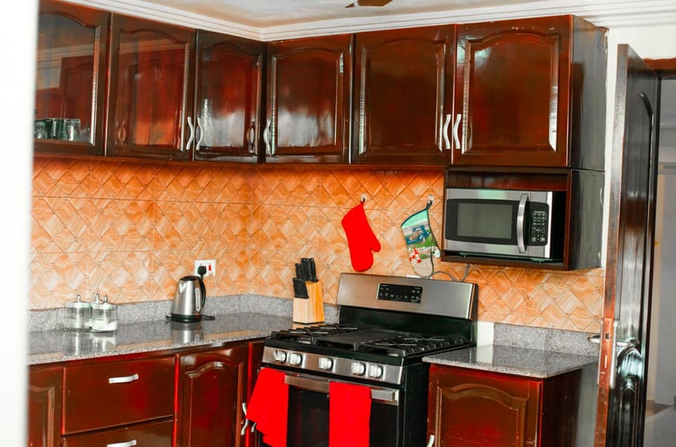 Kitchen has 5 burners, kettle, rice cooker,refrigerator and everything 4 cooking