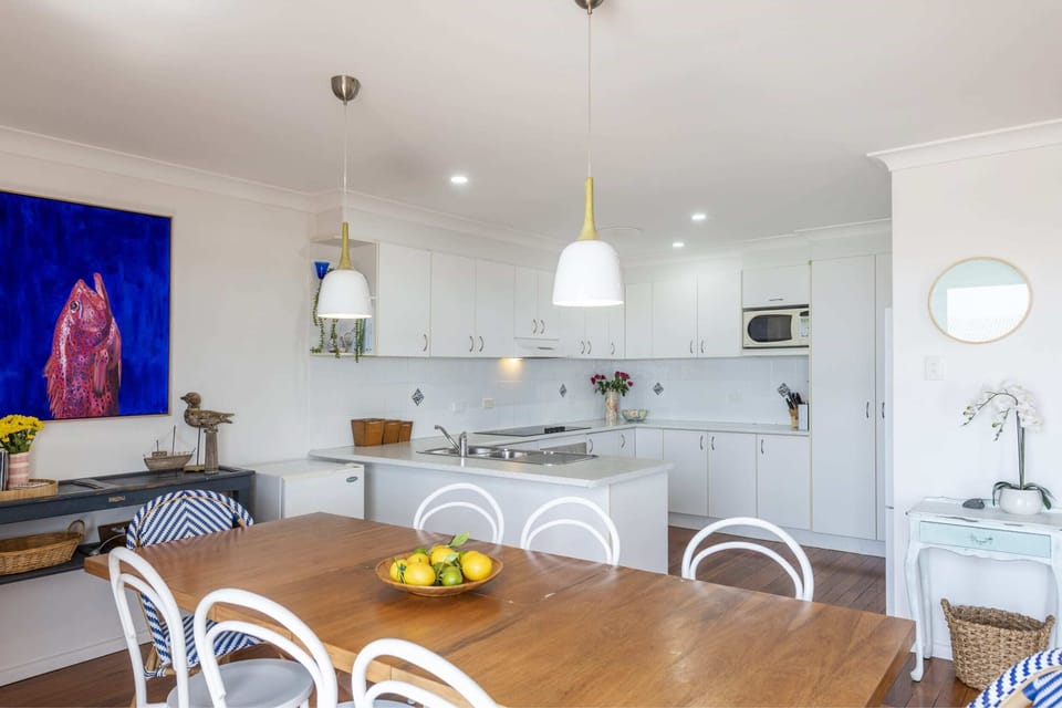 Bimbajong Main Beach - Coast accommodation in Yamba town with Ocean views - Open plan kitchen, living & dining with ocean views