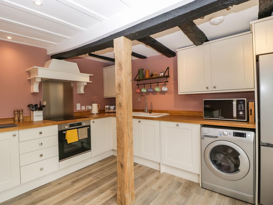 Fridge, electric kettle, cookware/dishes/utensils