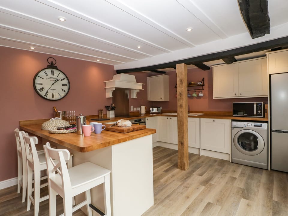 Fridge, electric kettle, cookware/dishes/utensils