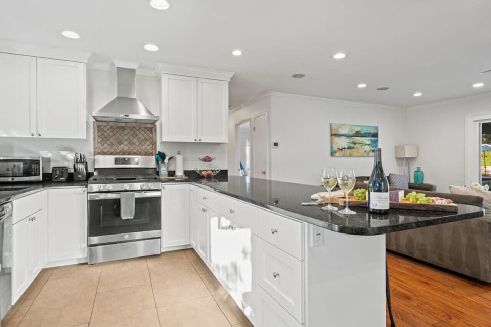Utilize the beautiful kitchen for all cooking needs. Equipped with full amenities.