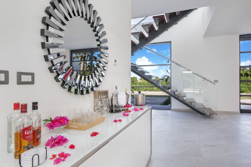 Bar area of the living room with views towards the stairway to 2nd floor