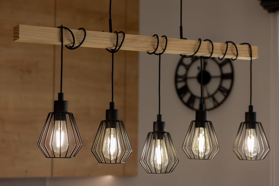 A close-up of stylish industrial-style pendant lights, adding a unique and modern touch to the interior.
