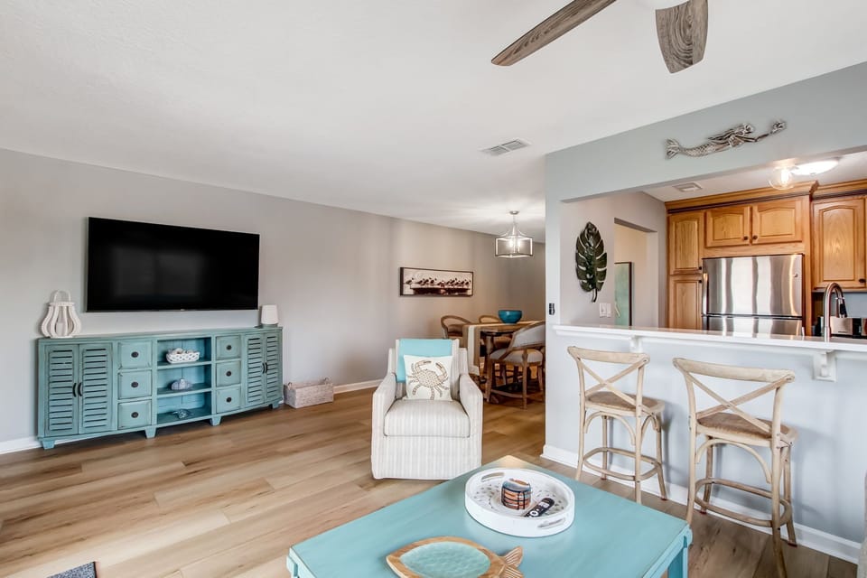 Gorgeous Ocean Views from this Open Concept Living, Dining and Kitchen Space, with Sliding Glass Doors to Private Covered Deck