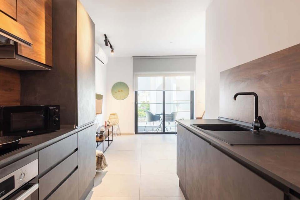 The Kitchen - Indulge in culinary delights after a day of Maltese exploration. Create flavorful memories in our fully-equipped kitchen