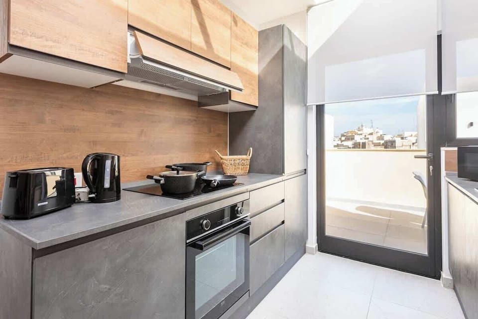 The Kitchen - Indulge in culinary delights after a day of Maltese exploration. Create flavorful memories in our fully-equipped kitchen.