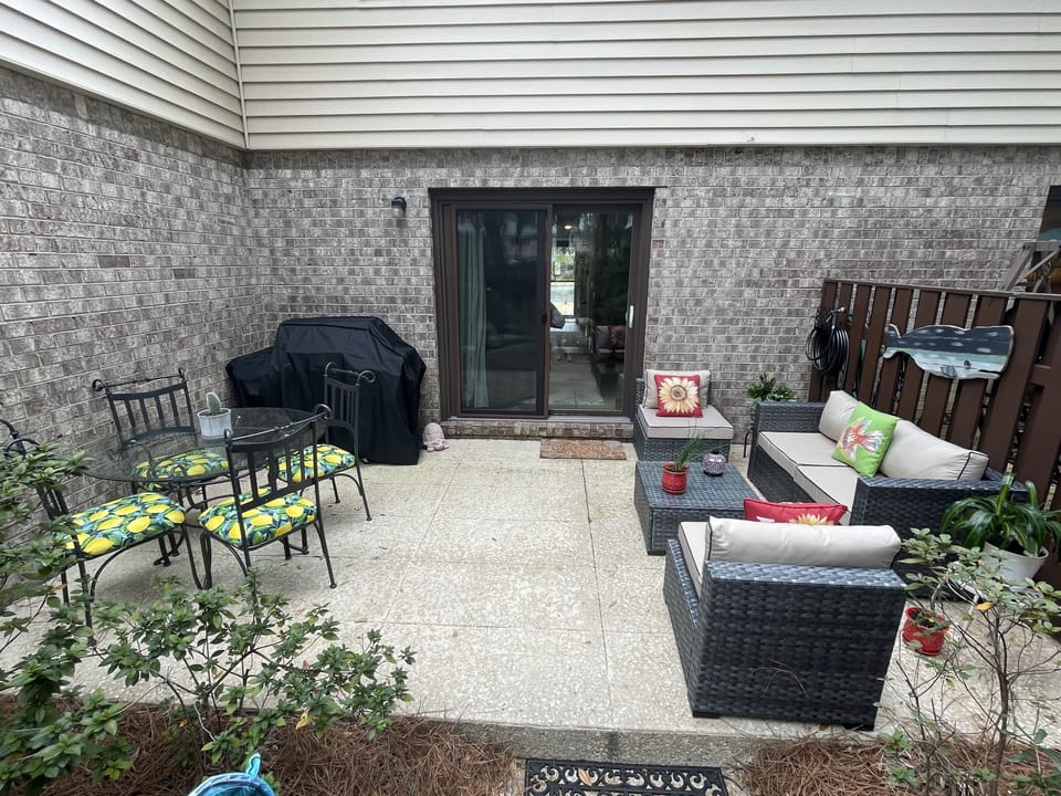 ALL NEW OUTSIDE FURNITURE AND GRILL. PLEASE ENJOY. BACKS UP TO THE POOL.