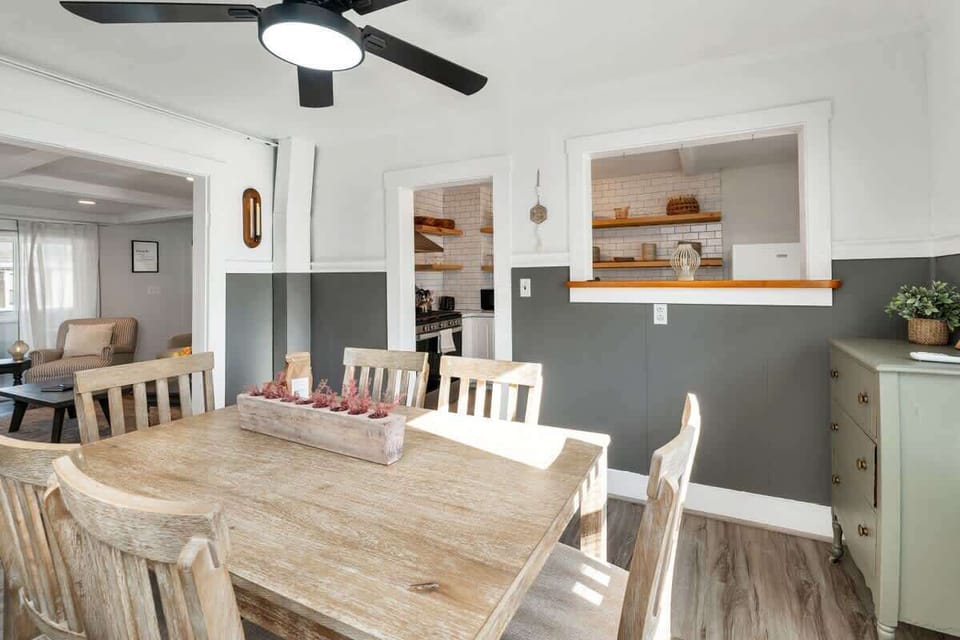 Dining room area with kitchen and living room in background