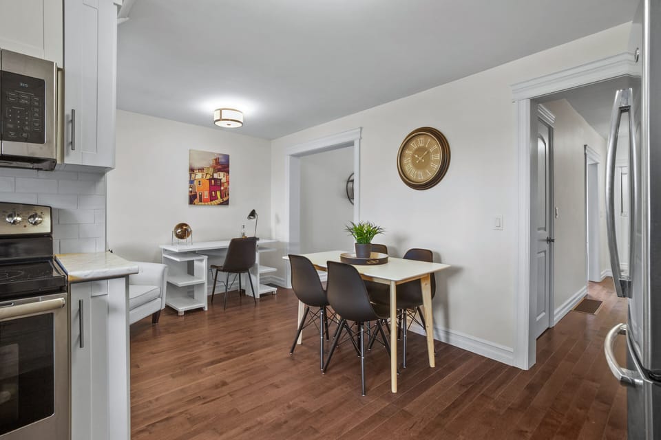 Chic and functional: Unwind at our dining table, find focus in the dedicated work space, all within arm's reach of our open kitchen – the heart of your home away from home. 🍽️💻✨ #CozyLiving #WorkAndPlay